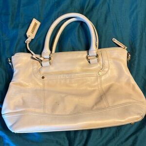 Tignanello purse in cream. Wear and staining as shown.